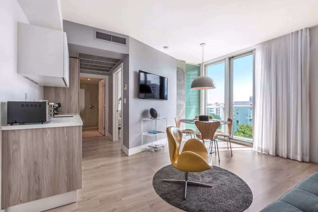 Modern open-plan kitchen and living room in a Miami Beach vacation rental condo